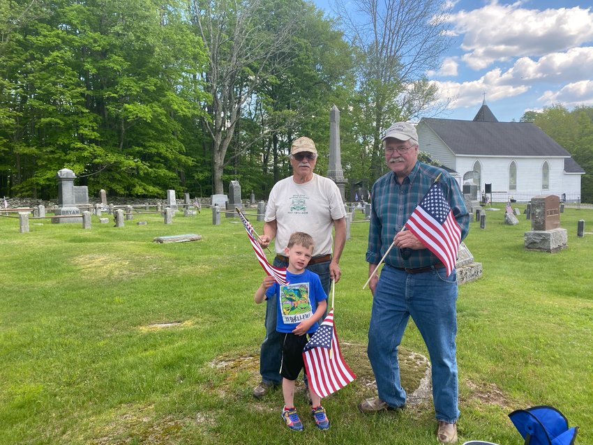 Pictured are Veterans of Foreign Wars Post 5808 members Keith Krauss, left, with his grandson, Kristopher Snedeker, and Steve Knutsen at the Fosterdale Cemetery.